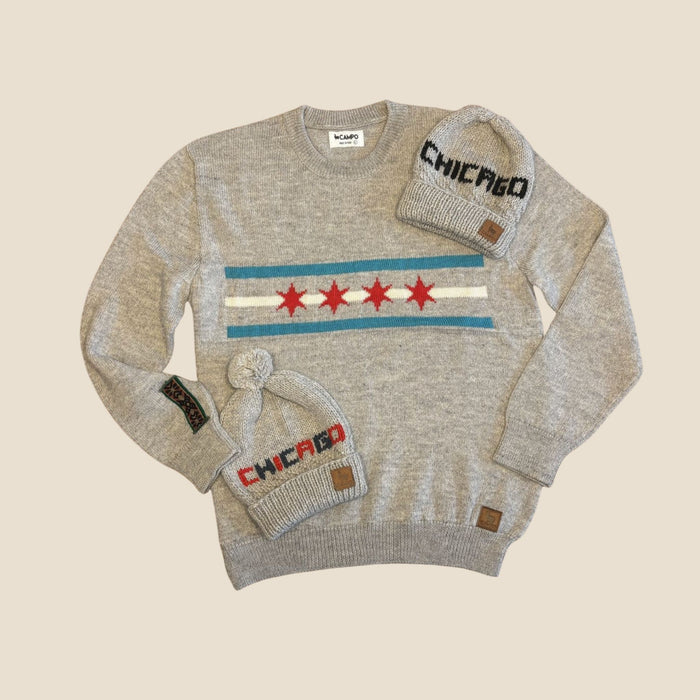 Gray sweater and matching beanie with 'Chicago' text on a beige background