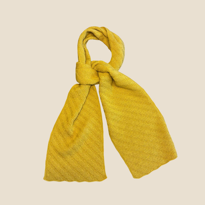 Mustard scarf on a beige background