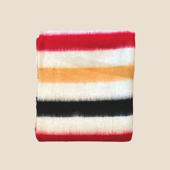Striped fabric with red, white, orange, and black on a beige background