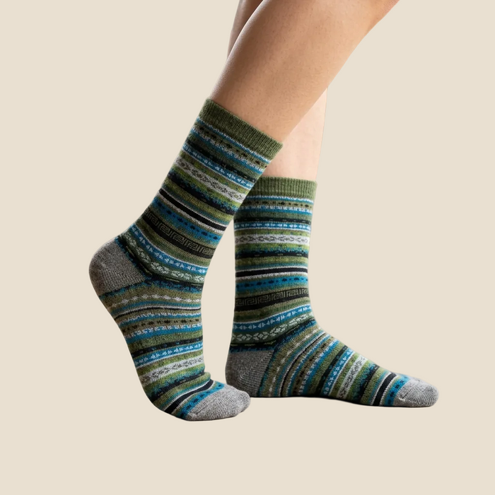 Striped socks worn on a beige background