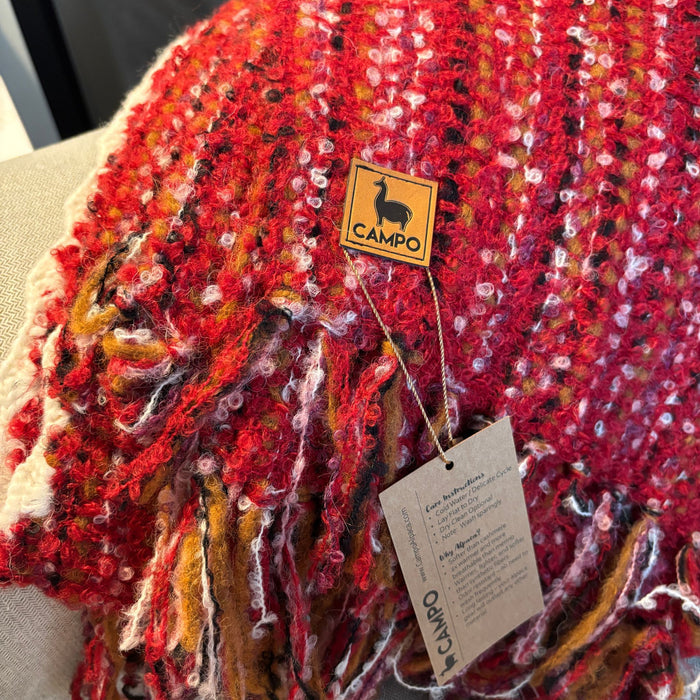 Red textured fabric with a 'Campo' brand tag on a beige background