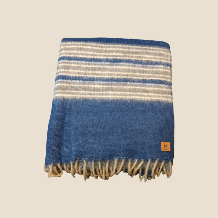 Striped blanket with blue and beige colors on a white background