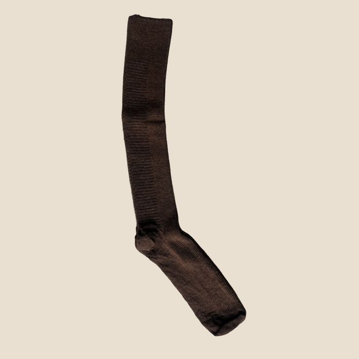 Brown knee-high sock on a gray background
