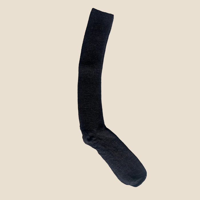 Black sock on a gray surface