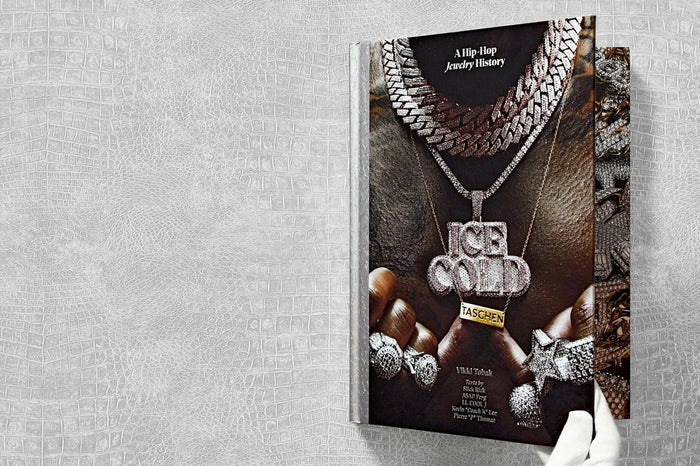Book titled 'A Hip Hop Jewelry History' with jewelry images on a textured gray background