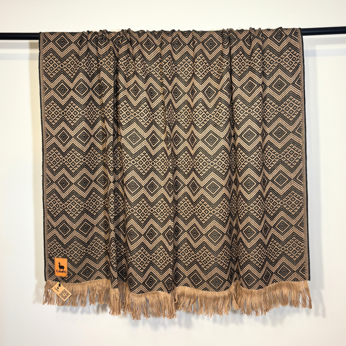 Patterned curtain with fringes on a white background