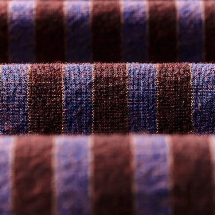 Close-up of striped fabric with blue and brown colors