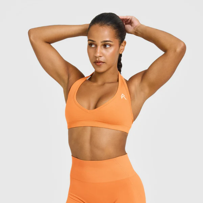 Oner Active - EffortlessLift Seamless Halter Neck Sports Bra with White Logo | Apricot Orange