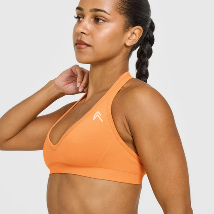 Oner Active - EffortlessLift Seamless Halter Neck Sports Bra with White Logo | Apricot Orange