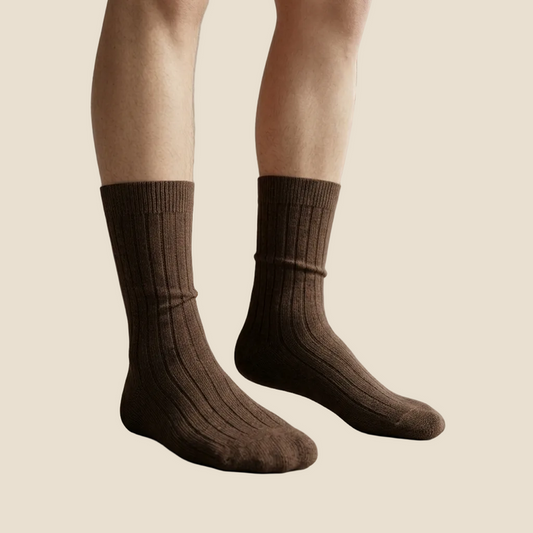 Brown socks worn by a person indoors with a neutral background