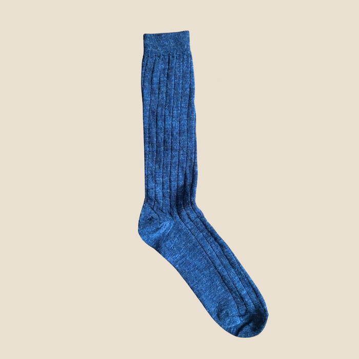 Denim sock on a beige background