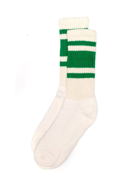 6d595cde3b1923a5c252248b69ec7049ecaa12ce6cd5119e2f0027a3f12c616a front: pair of white crew socks with green stripes